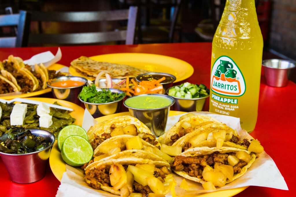 Jarritos Pineapple served with Tacos Al Pastor and sides