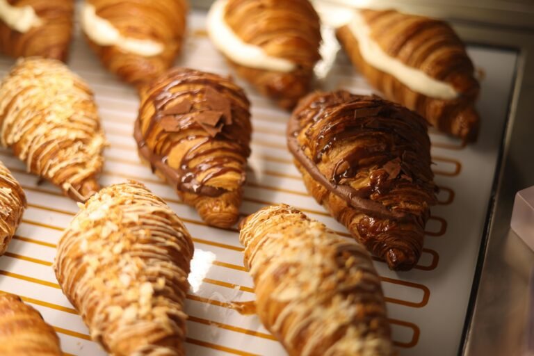 Close-up of Croissants with Chocolate and Cream on Display