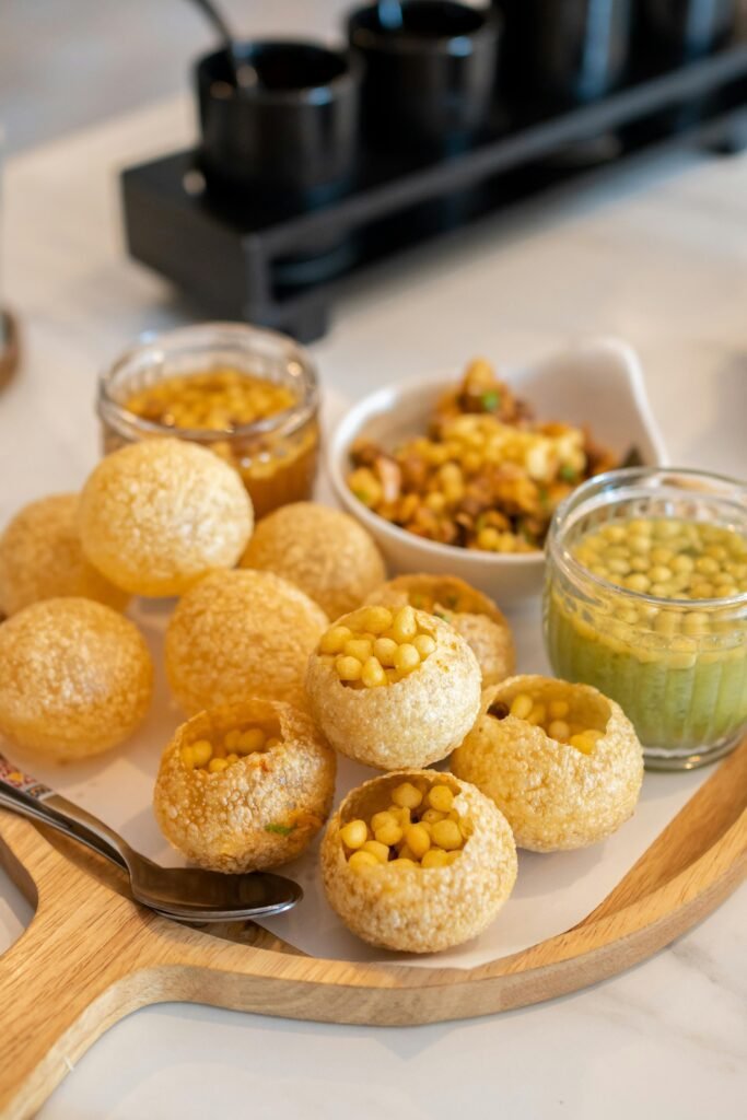 Indian Food Pani Puri on a Wooden Tray