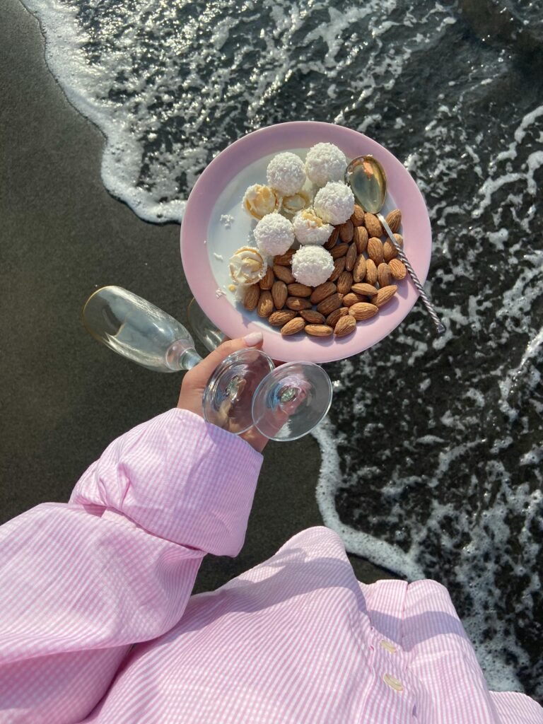 a women with food at the sea