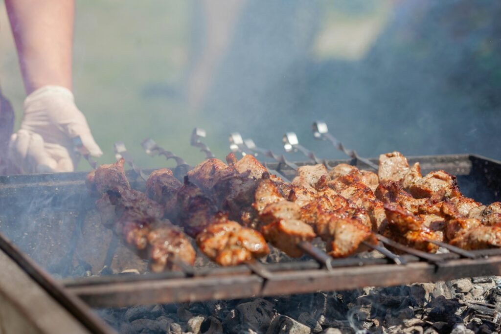 Close-Up Photo of Delicious Meat Being Grilled