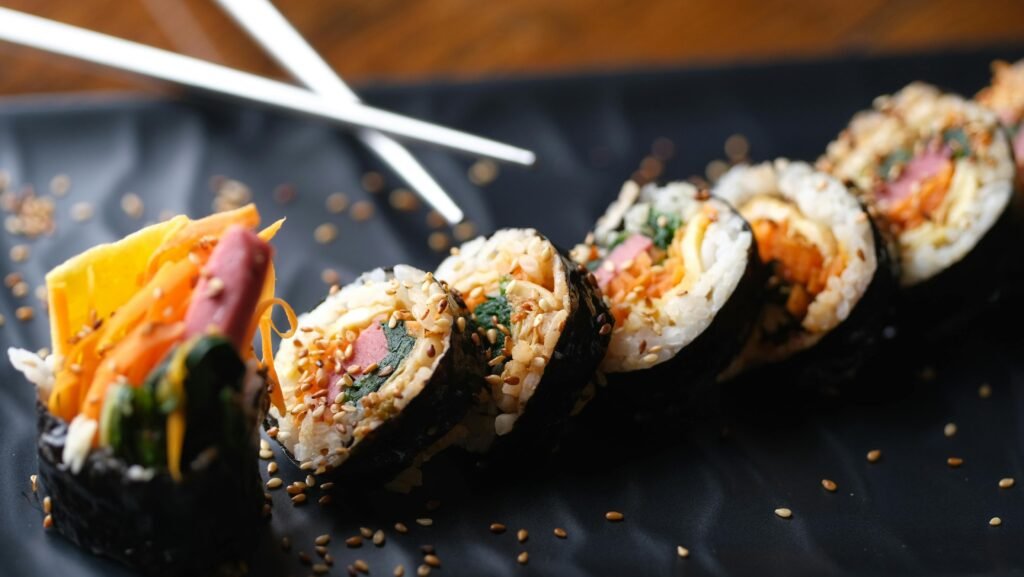 Close-up of Sushi Rolls and Chopsticks