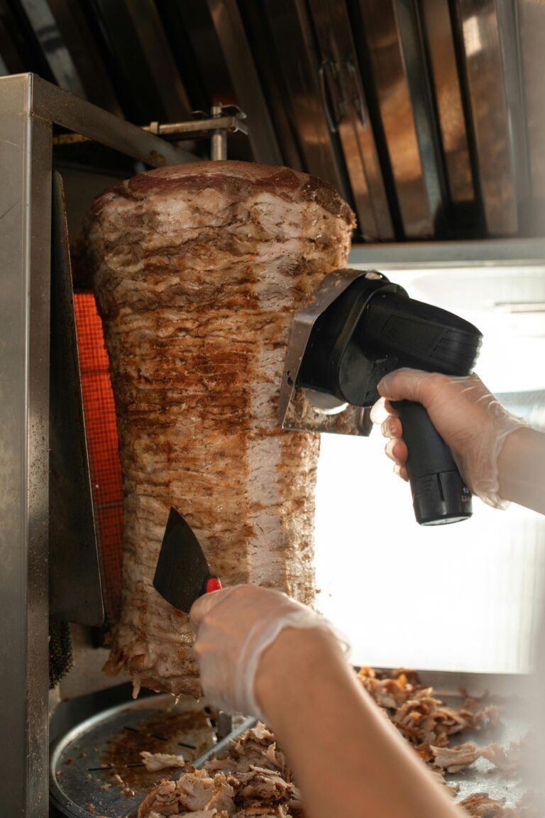 A Person Holding meat Shawarma