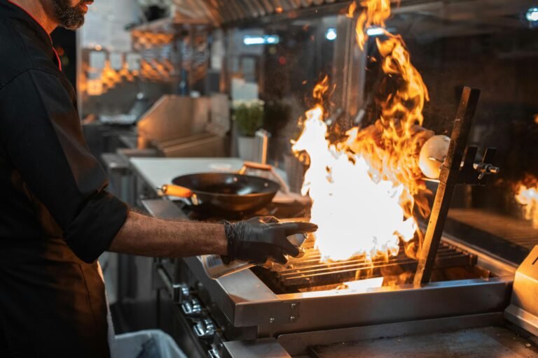 a man cooking beef shawarma